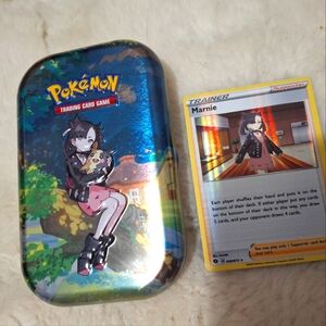 Marnie Trainer Pokemon Card Holographic And Empty Tin